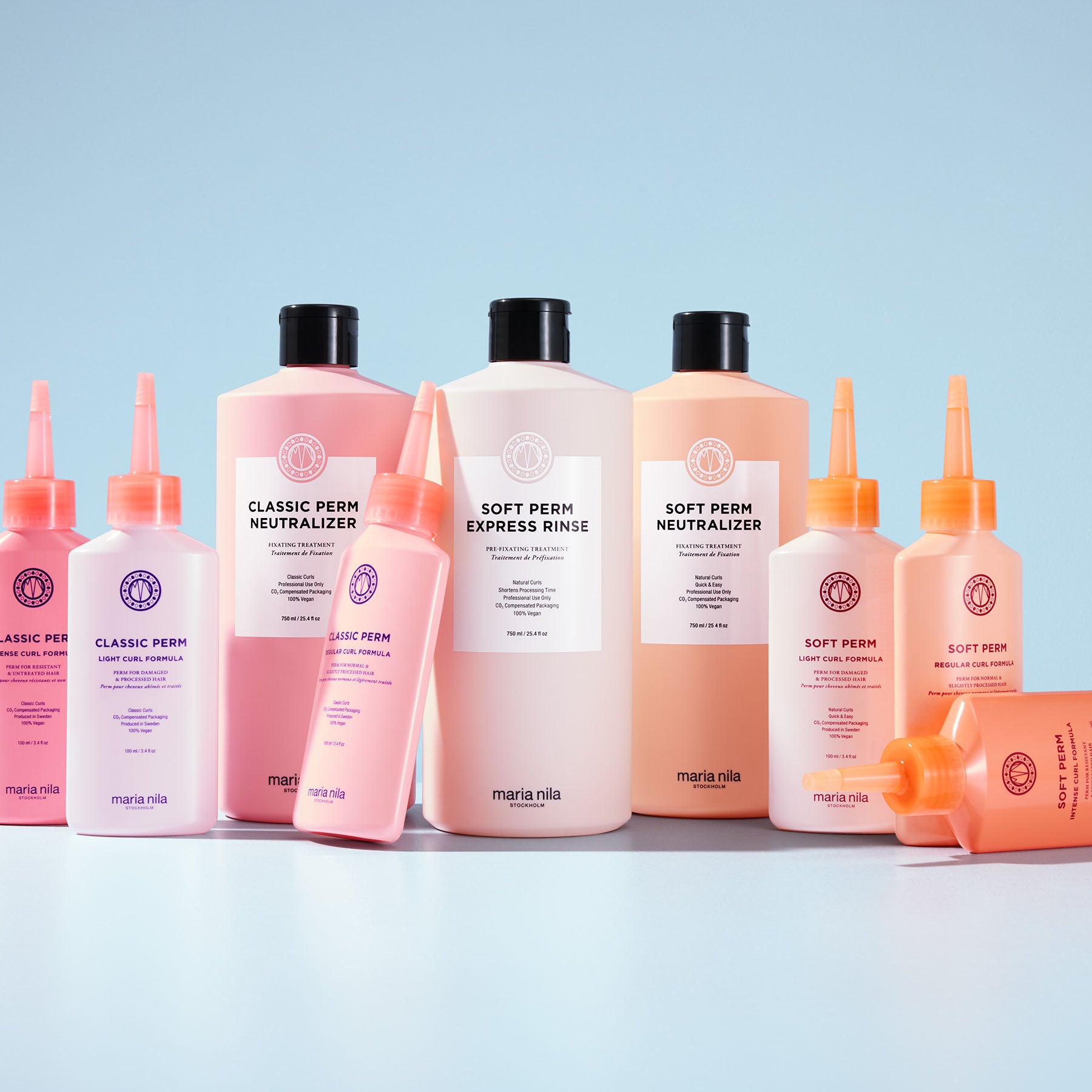 Collection of Maria Nila Per Collection on a light blue background