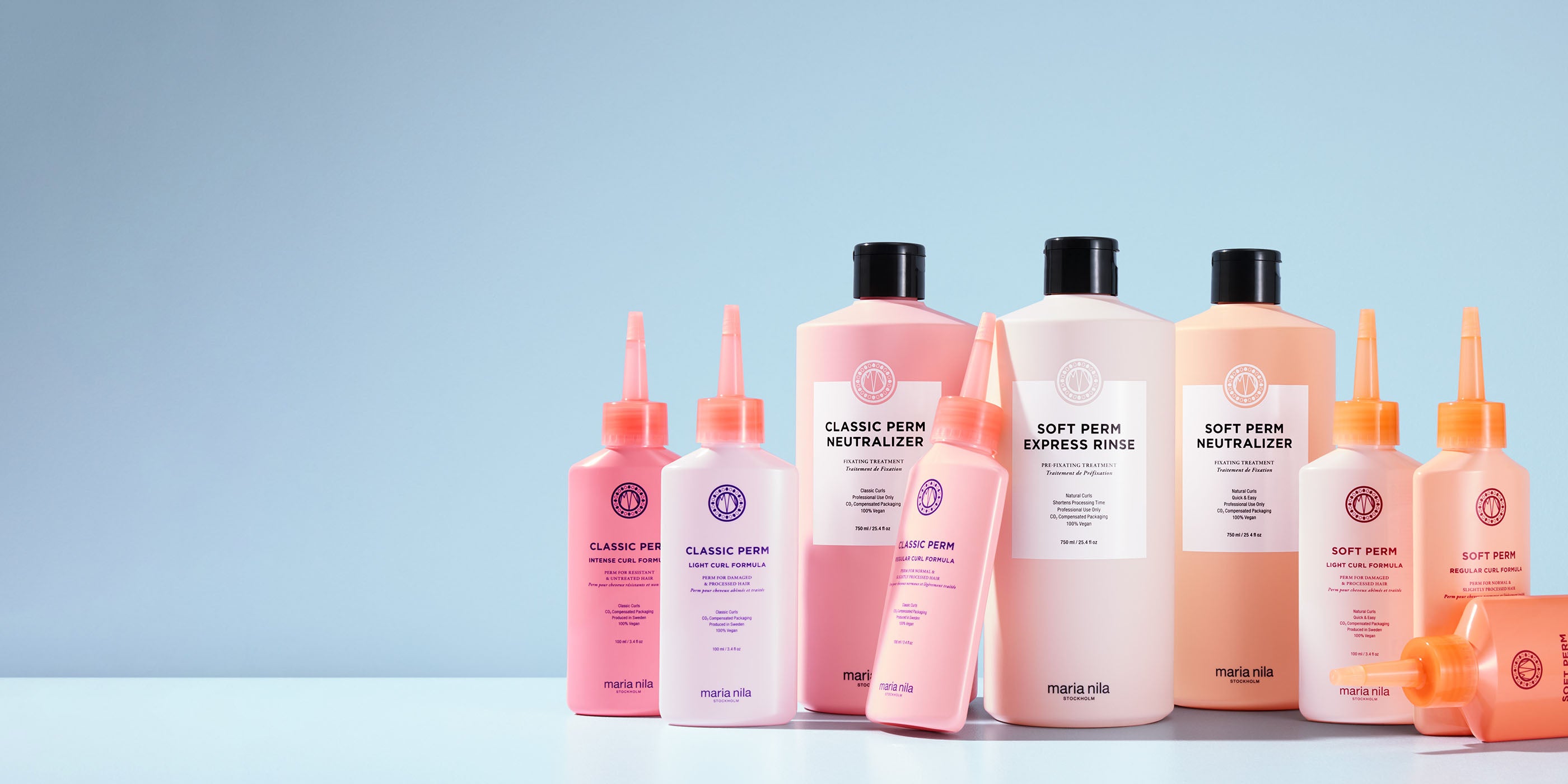 Maria Nila Perm Collection products on light blue background.